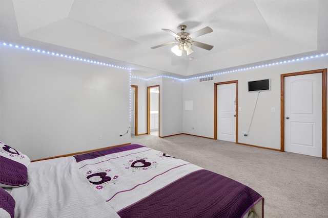 3413 Brook Run Dr, Des Moines, IA 50317 - bedroom featuring a tray ceiling and carpet floors