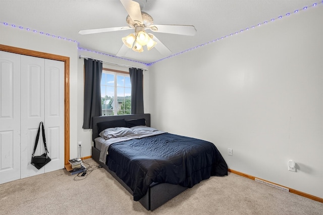 3413 Brook Run Dr, Des Moines, IA 50317 - bedroom featuring carpet, a closet, and a ceiling fan