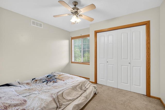 3413 Brook Run Dr, Des Moines, IA 50317 - carpeted bedroom with a closet and a ceiling fan