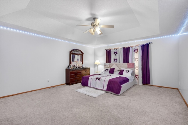 3413 Brook Run Dr, Des Moines, IA 50317 - bedroom with carpet, a raised ceiling, and ceiling fan