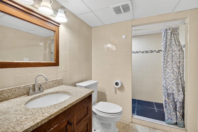 3413 Brook Run Dr, Des Moines, IA 50317 - full bathroom with tile walls, a tile shower, and vanity