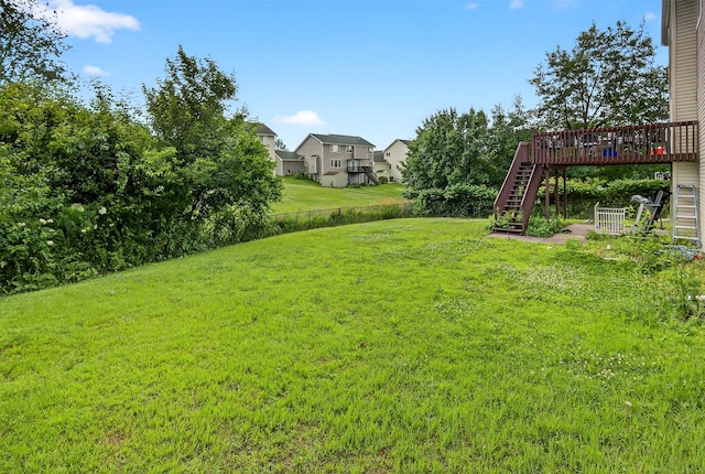 3413 Brook Run Dr, Des Moines, IA 50317 - view of yard featuring stairs, a deck, and a residential view