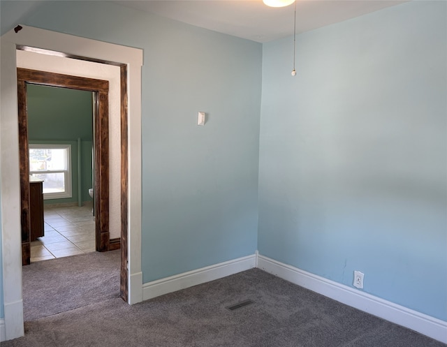 117 W Broadway St, Colfax, IA 50054 - carpeted empty room with baseboards