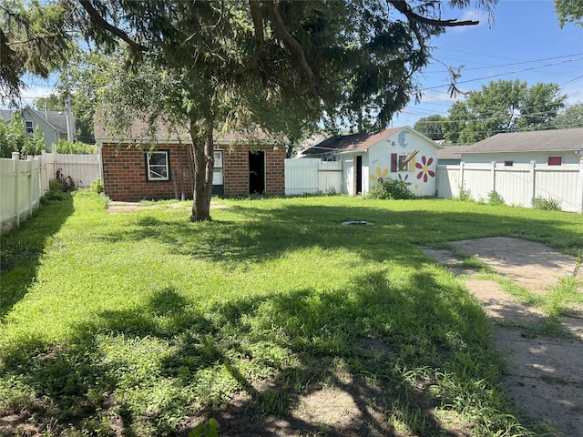 117 W Broadway St, Colfax, IA 50054 - fenced backyard featuring an outbuilding