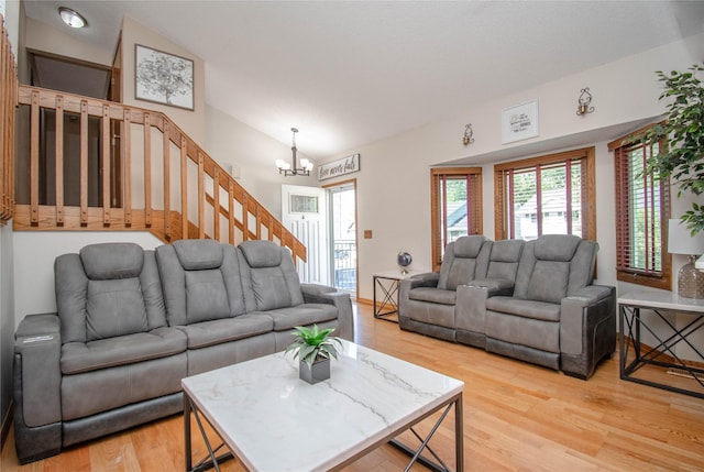 5420 SW 13th St, Des Moines, IA 50315 - living area with light wood-type flooring, a chandelier, stairs, and lofted ceiling