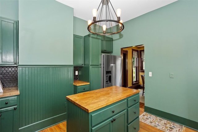 658 20th St, Des Moines, IA 50314 - kitchen featuring green cabinets, wood counters, high end refrigerator, a chandelier, and light wood-style floors