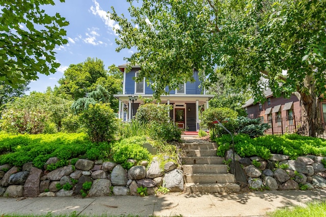 658 20th St, Des Moines, IA 50314 - view of front of home featuring a porch and stairs