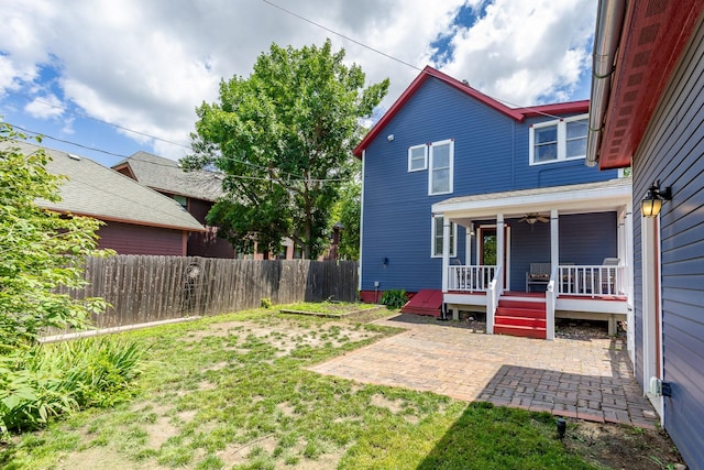 658 20th St, Des Moines, IA 50314 - view of yard featuring a patio and a wooden deck