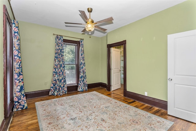 658 20th St, Des Moines, IA 50314 - bedroom with wood finished floors and a ceiling fan