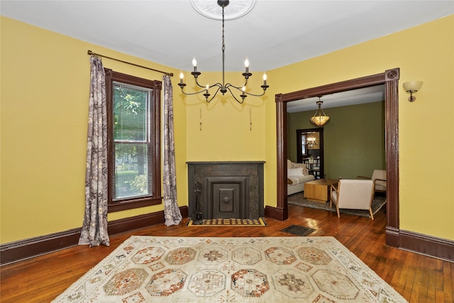 658 20th St, Des Moines, IA 50314 - living area with a chandelier and hardwood / wood-style flooring