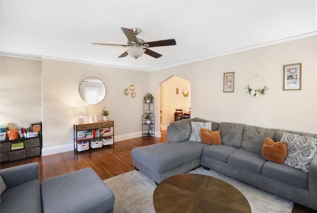 618 Arthur Ave, Des Moines, IA 50313 - living room featuring arched walkways, ceiling fan, wood finished floors, and crown molding