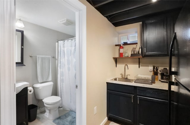 618 Arthur Ave, Des Moines, IA 50313 - bathroom with vanity, a shower with curtain, and tile patterned floors