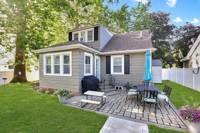 618 Arthur Ave, Des Moines, IA 50313 - rear view of property with a patio area, a fenced backyard, and a shingled roof