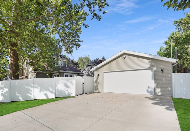 618 Arthur Ave, Des Moines, IA 50313 - view of side of home featuring a garage and an outbuilding
