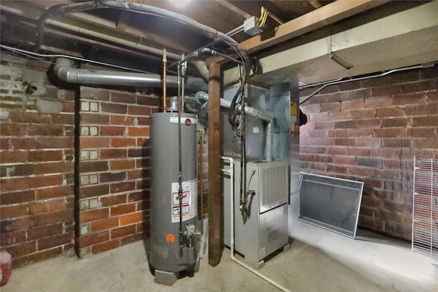 618 Arthur Ave, Des Moines, IA 50313 - utility room with gas water heater and heating unit