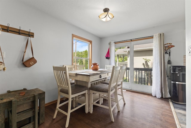 1324 College Ave, Des Moines, IA 50314 - dining room with wood finished floors