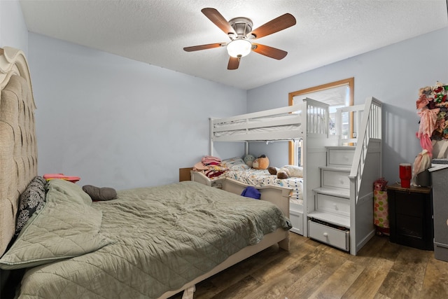 1324 College Ave, Des Moines, IA 50314 - bedroom with wood finished floors, ceiling fan, and a textured ceiling