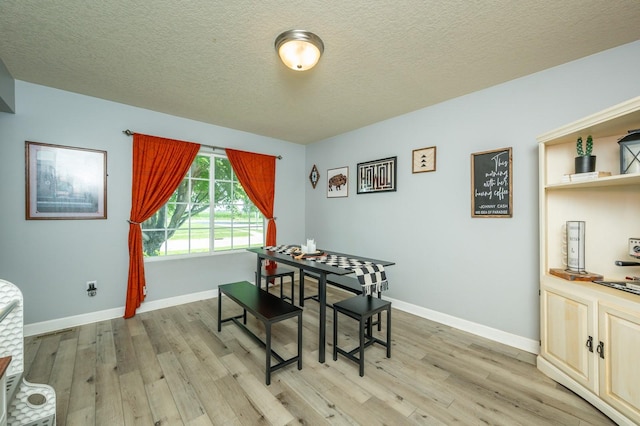 550 25th St SE, Altoona, IA 50009 - dining area with light wood finished floors and a textured ceiling