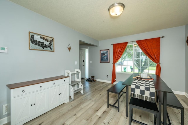 550 25th St SE, Altoona, IA 50009 - dining room with light wood-type flooring and baseboards