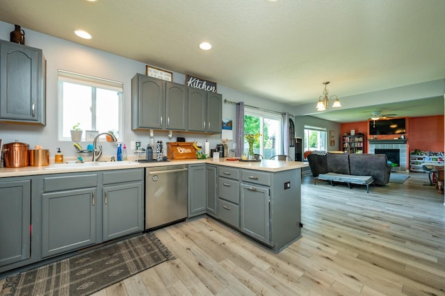 550 25th St SE, Altoona, IA 50009 - kitchen featuring stainless steel dishwasher, gray cabinetry, a peninsula, light countertops, and recessed lighting