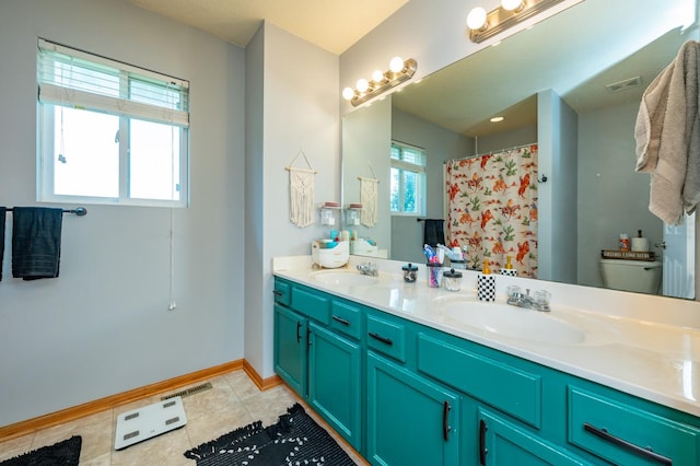 550 25th St SE, Altoona, IA 50009 - bathroom featuring double vanity, tile patterned flooring, and curtained shower