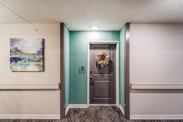 9065 Bishop Dr Unit 314, West Des Moines, IA 50266 - foyer entrance with a textured ceiling and dark carpet