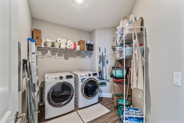 9065 Bishop Dr Unit 314, West Des Moines, IA 50266 - laundry room featuring washing machine and clothes dryer and wood finished floors