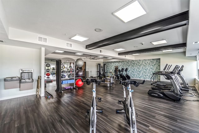 9065 Bishop Dr Unit 314, West Des Moines, IA 50266 - exercise room with wood finished floors and beamed ceiling