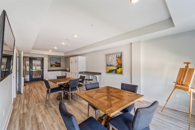9065 Bishop Dr Unit 314, West Des Moines, IA 50266 - dining space with a raised ceiling, light wood finished floors, and recessed lighting
