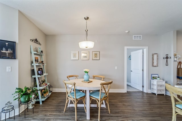 9065 Bishop Dr Unit 314, West Des Moines, IA 50266 - dining room featuring dark wood-style floors and baseboards