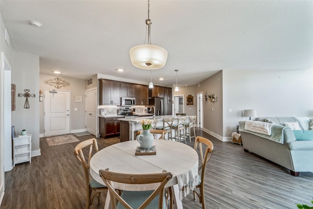 9065 Bishop Dr Unit 314, West Des Moines, IA 50266 - dining area featuring dark wood-style flooring and recessed lighting
