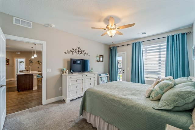 9065 Bishop Dr Unit 314, West Des Moines, IA 50266 - carpeted bedroom with access to exterior and a ceiling fan
