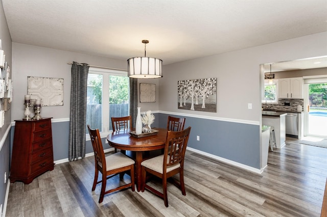 2507 135th St, Urbandale, IA 50323 - dining space featuring wood finished floors