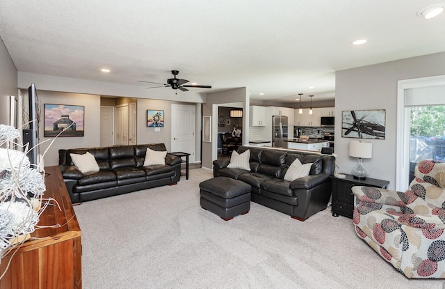 2507 135th St, Urbandale, IA 50323 - carpeted living room with ceiling fan and recessed lighting