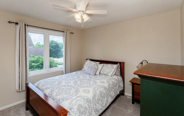 2507 135th St, Urbandale, IA 50323 - carpeted bedroom featuring baseboards and ceiling fan