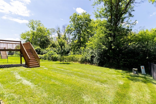 2529 SE Integra Ave, West Des Moines, IA 50265 - view of yard featuring stairway and a wooden deck