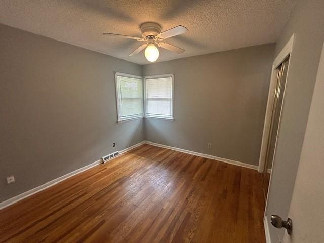 3412 Crestmoor Pl, Des Moines, IA 50310 - empty room featuring a ceiling fan, wood finished floors, and a textured ceiling