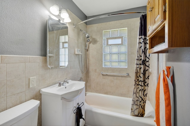 2704 Wedgewood Rd, Des Moines, IA 50317 - bathroom with shower / bath combo with shower curtain, vanity, and tile walls