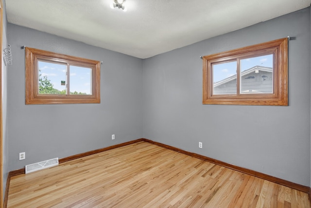 2704 Wedgewood Rd, Des Moines, IA 50317 - unfurnished room with plenty of natural light and wood finished floors