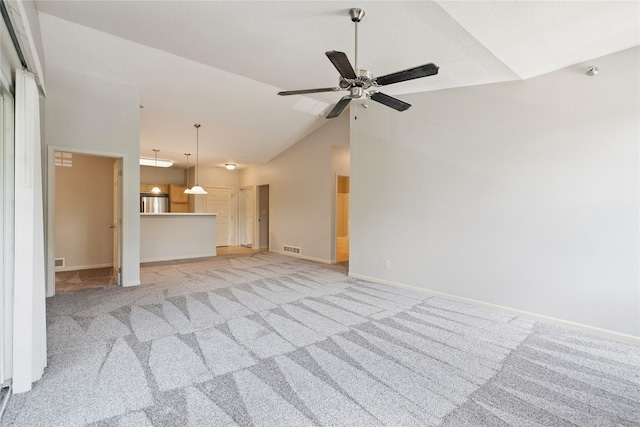 1313 SE University Ave Unit 206, Waukee, IA 50263 - unfurnished living room with vaulted ceiling, light carpet, and ceiling fan