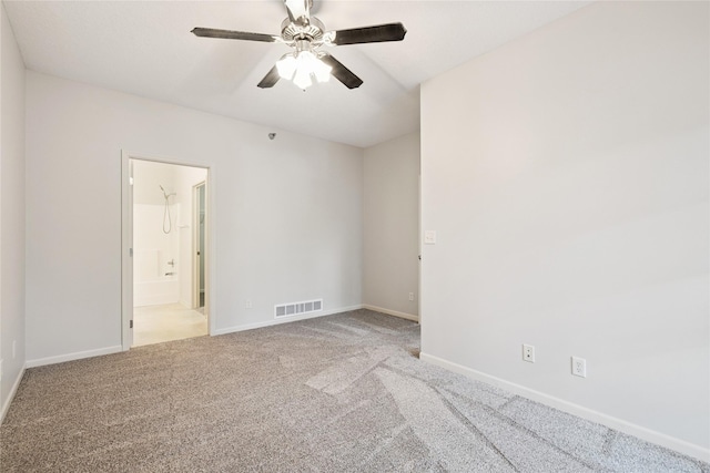 1313 SE University Ave Unit 206, Waukee, IA 50263 - carpeted spare room featuring a ceiling fan and baseboards