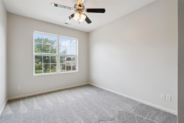 1313 SE University Ave Unit 206, Waukee, IA 50263 - spare room featuring carpet and a ceiling fan
