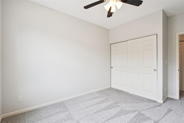 1313 SE University Ave Unit 206, Waukee, IA 50263 - unfurnished bedroom with carpet, a closet, and a ceiling fan