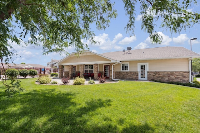 1313 SE University Ave Unit 206, Waukee, IA 50263 - back of house featuring stone siding and a patio