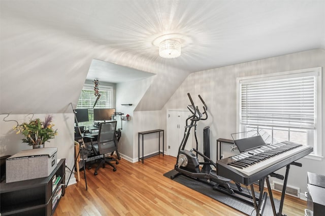 3923 Maquoketa Dr, Des Moines, IA 50311 - exercise area with light wood finished floors and vaulted ceiling