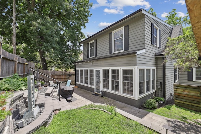 3923 Maquoketa Dr, Des Moines, IA 50311 - back of house with a patio area