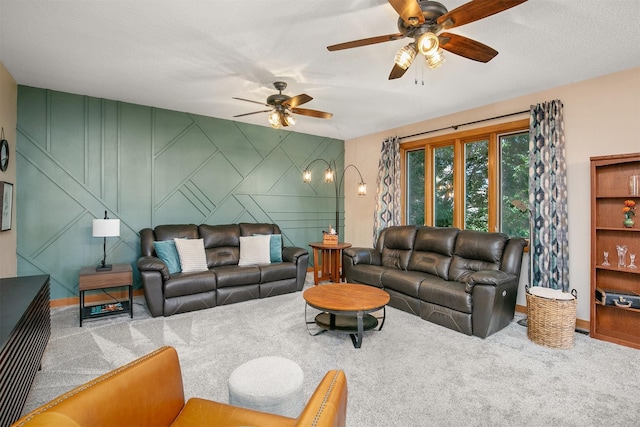 13001 Twana Dr, Urbandale, IA 50323 - carpeted living room featuring ceiling fan and baseboards