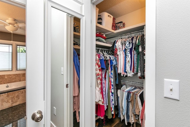 13001 Twana Dr, Urbandale, IA 50323 - walk in closet with a ceiling fan