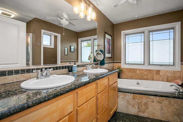 13001 Twana Dr, Urbandale, IA 50323 - full bath featuring a ceiling fan, double vanity, a bath, and a stall shower