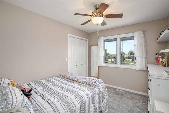 13001 Twana Dr, Urbandale, IA 50323 - bedroom featuring light carpet, a closet, and ceiling fan